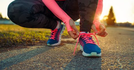 Runner Tying Shoes