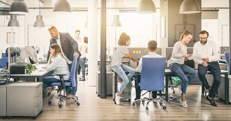 Workers In Casual Attire In Office Setting