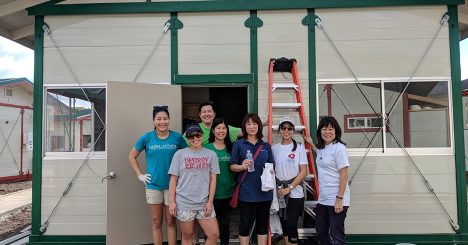 Cades Schutte Volunteers In Front Of Home At Kahauiki Village