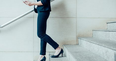 Woman Walking Down Stairs In Heels