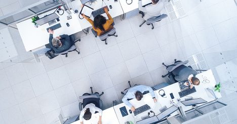 View Of Office Workers At Desks From Above