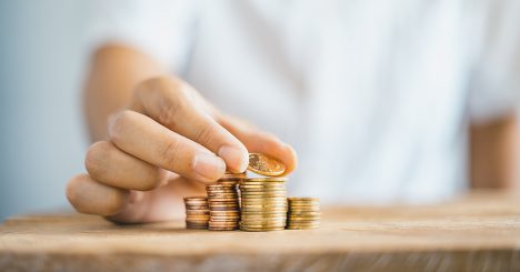 Hand Stacking Coins