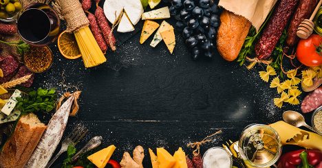 Food Laid Out In A Circle On A Black Table