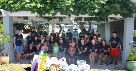 Cades Schutte Beach Cleanup Volunteers Sitting Behind Trash Collected