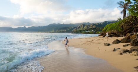 Child Playing On Beach In Oahu Hawaii