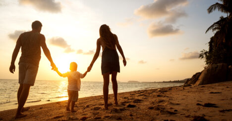 Family Walk Along The Beach At Sunset With His Son, Silhouette