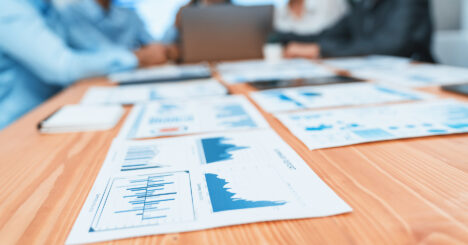 Focus Dashboard Paper Showing Graphs And Chart With Blurred Background. Concord